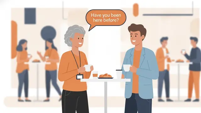 Konferans kahve arasında yüksek bir masanın başında kahve fincanlarıyla sohbet eden orta yaşlı bir kadın ve genç bir adam